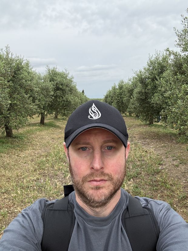Standing among the trees at Basilippo Oleoturismo, an olive oil estate near Sevilla